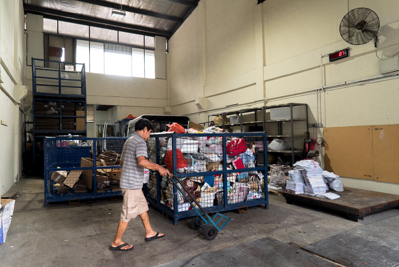 Rice-Media-Trash-Treasure-Life-Paper-8 Mr Tan unloading the paper he collected.