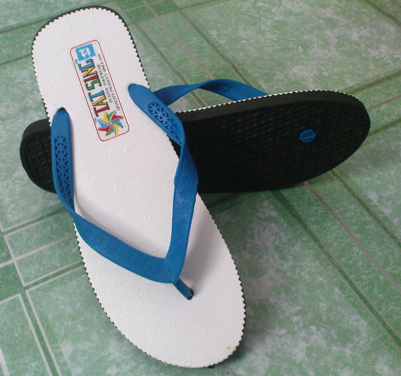 white and blue slippers